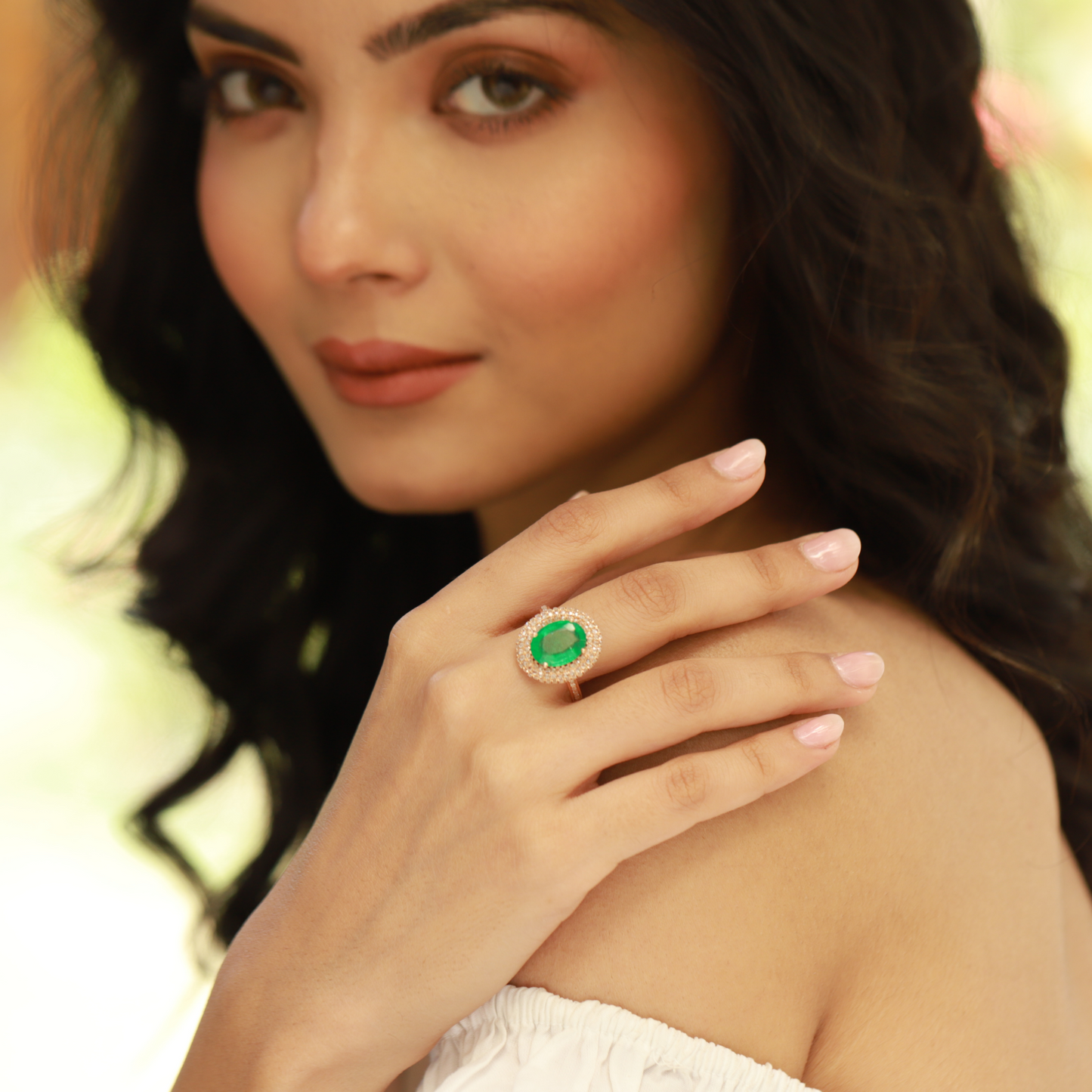 Oval Emerald Ring with Diamond Halo