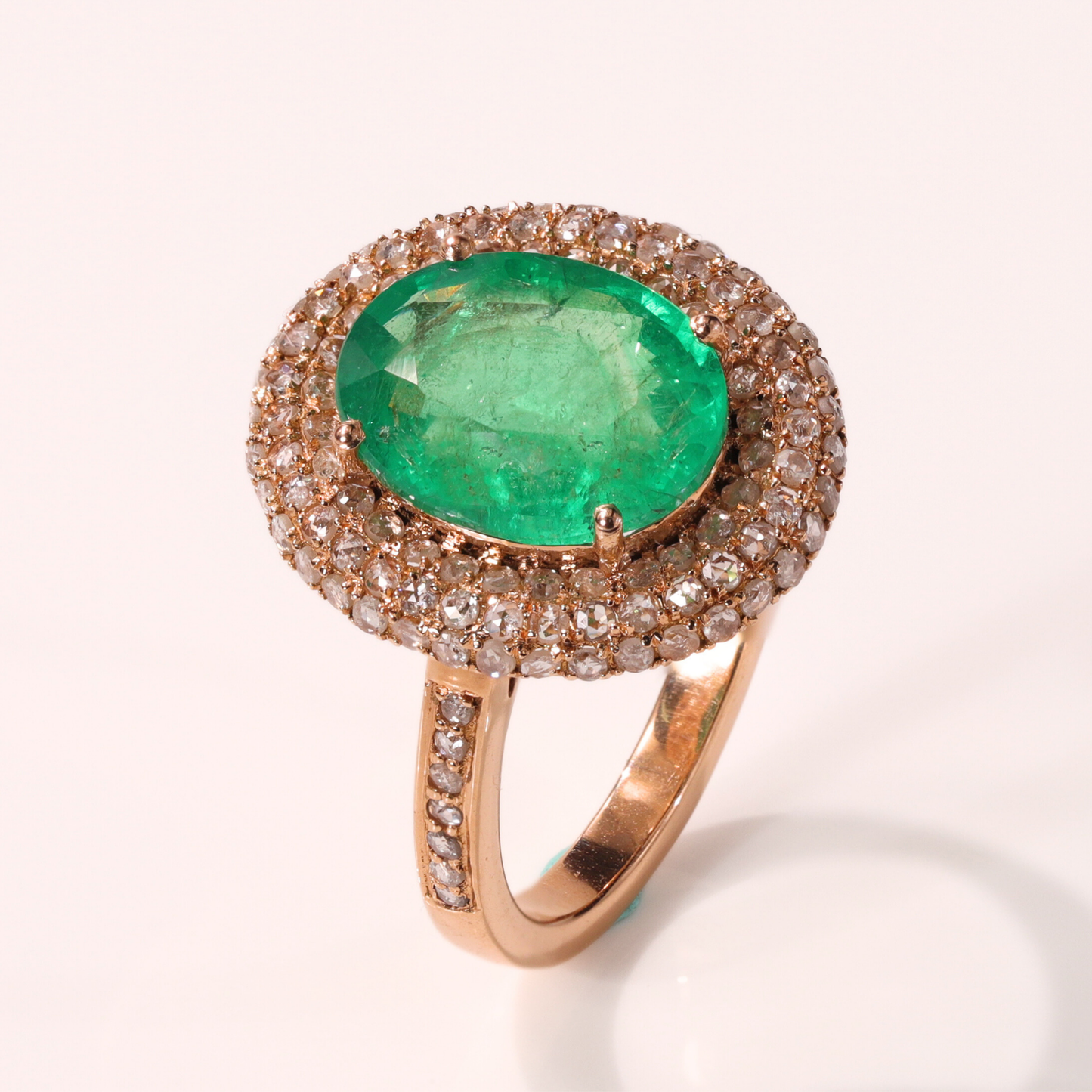 Oval Emerald Ring with Diamond Halo